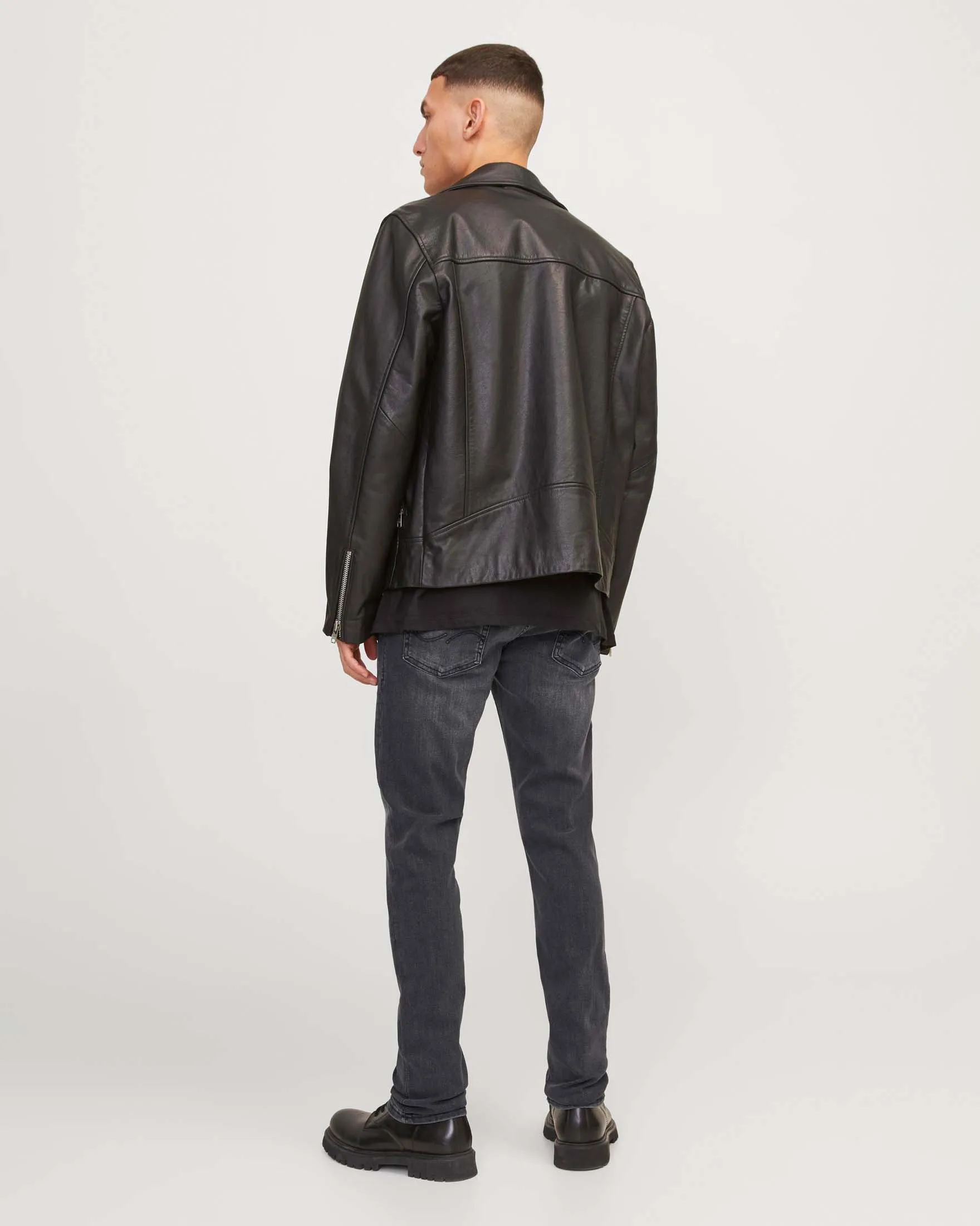 Jeans slim-fit a vita bassa in cotone stretch lavaggio nero con sabbiature